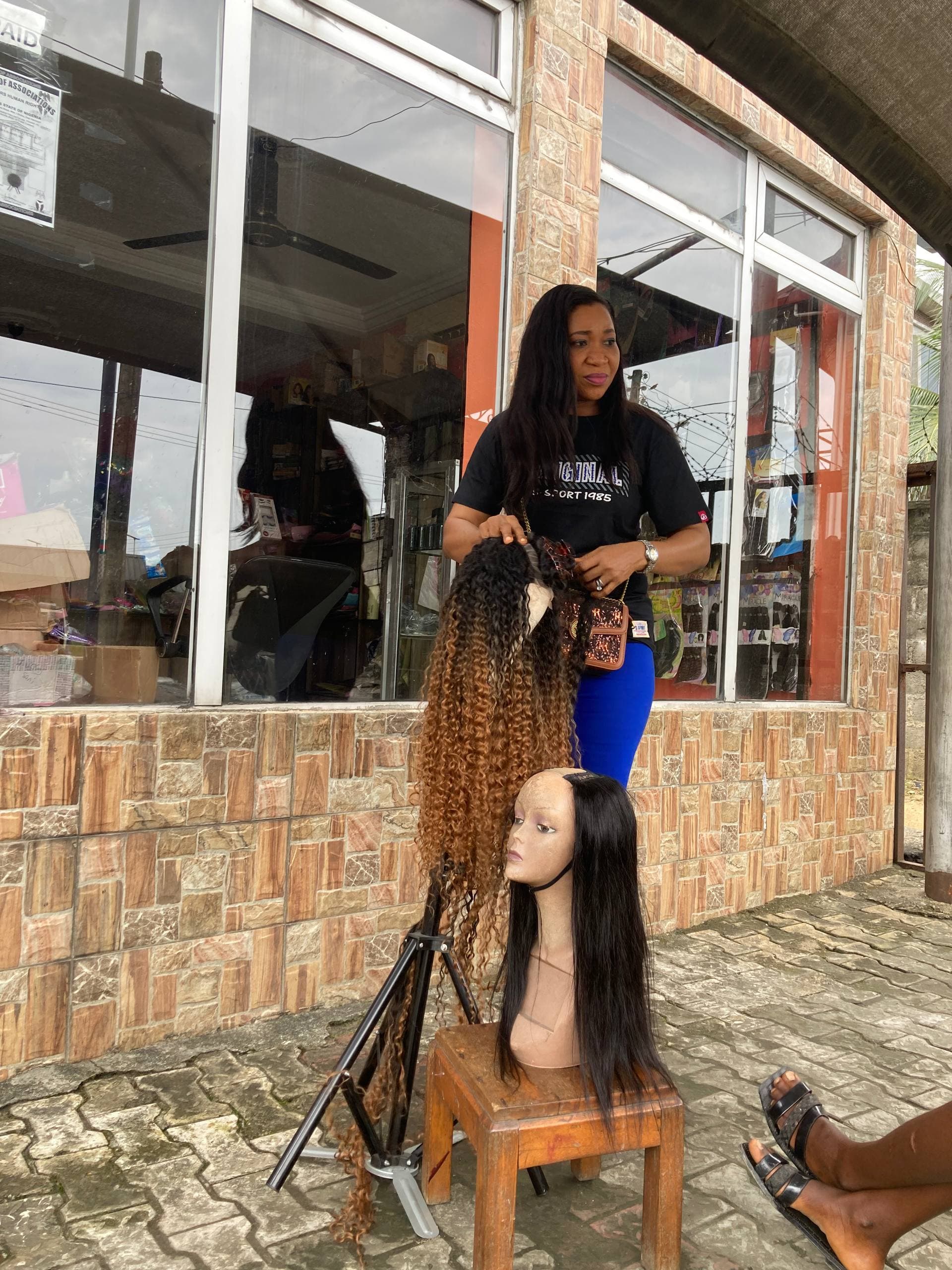 A trainer demonstrating practical hair styling skills