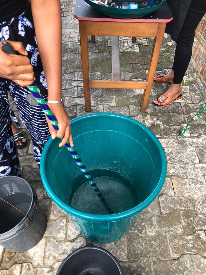 A participant mixing a soap batch during practical training