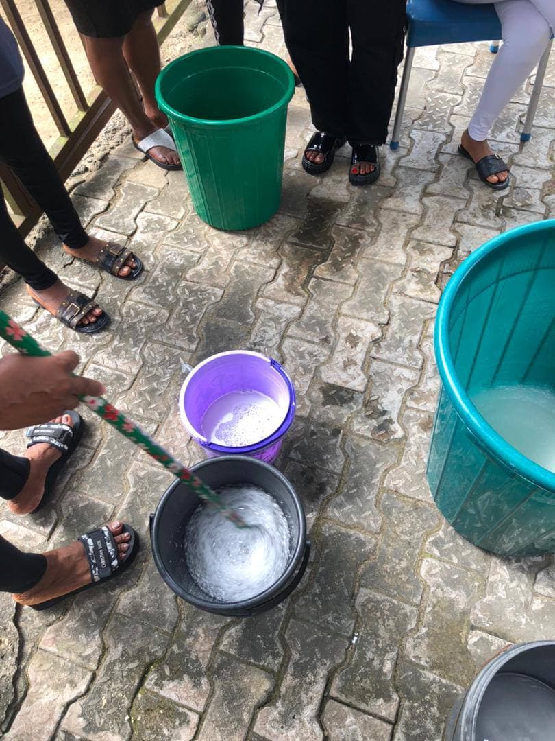 Participants stirring a soap mixture during training
