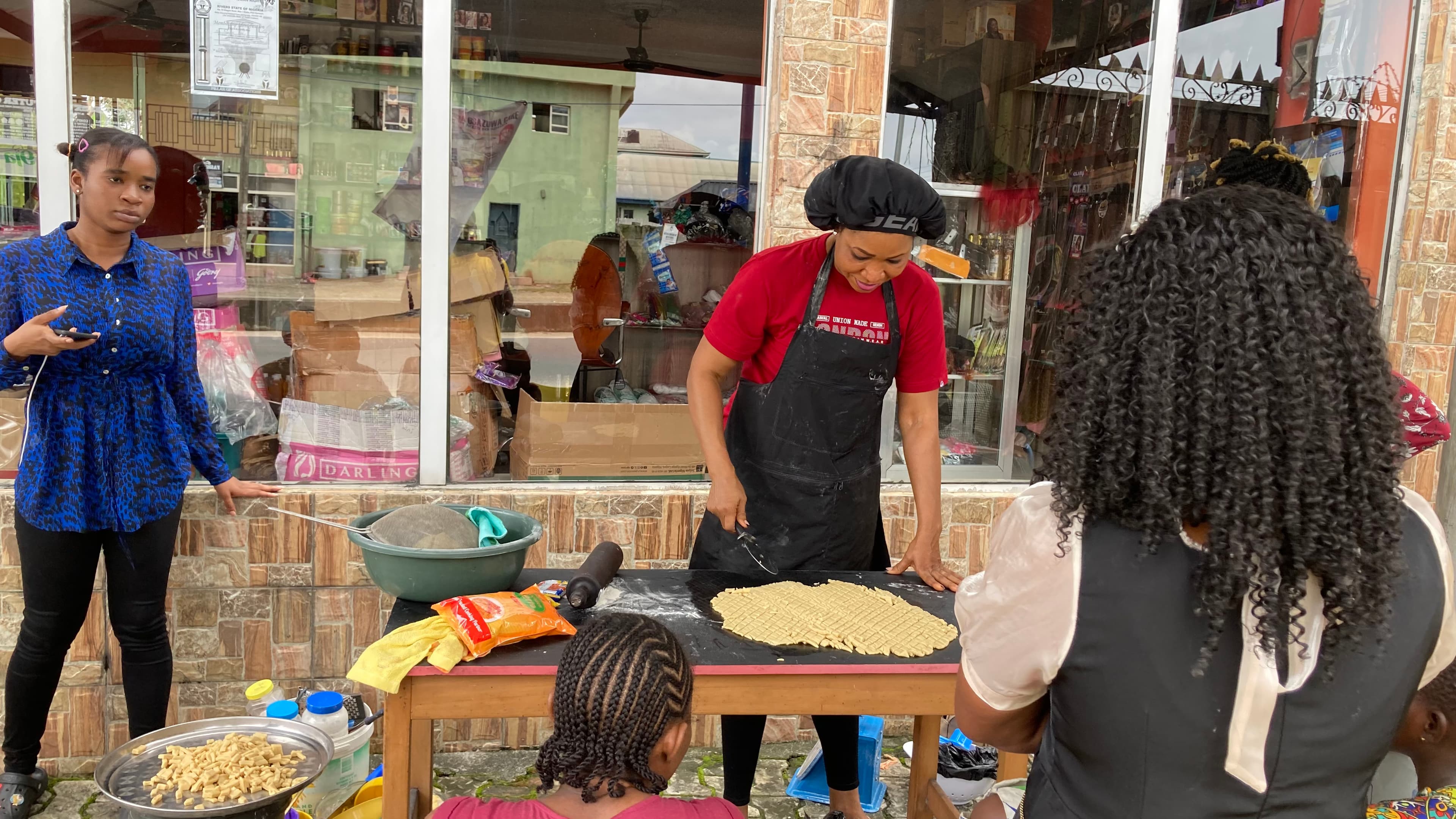 A trainer demonstrating a practical baking skill
